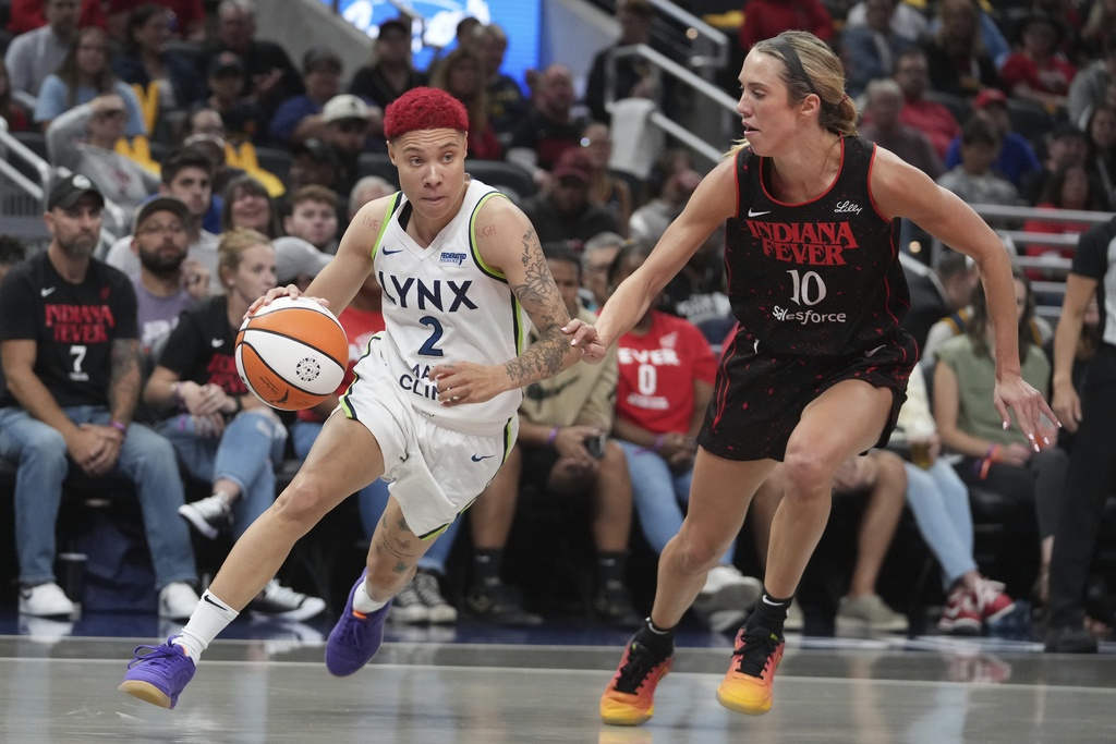 Minnesota Lynx's Natisha Hiedeman (2) goes to the basket against Indiana Fever's Lexie Hull during the first half of a WNBA basketball game, Tuesday, Sept. 9, 2025, in Indianapolis. (AP Photo/Darron Cummings)