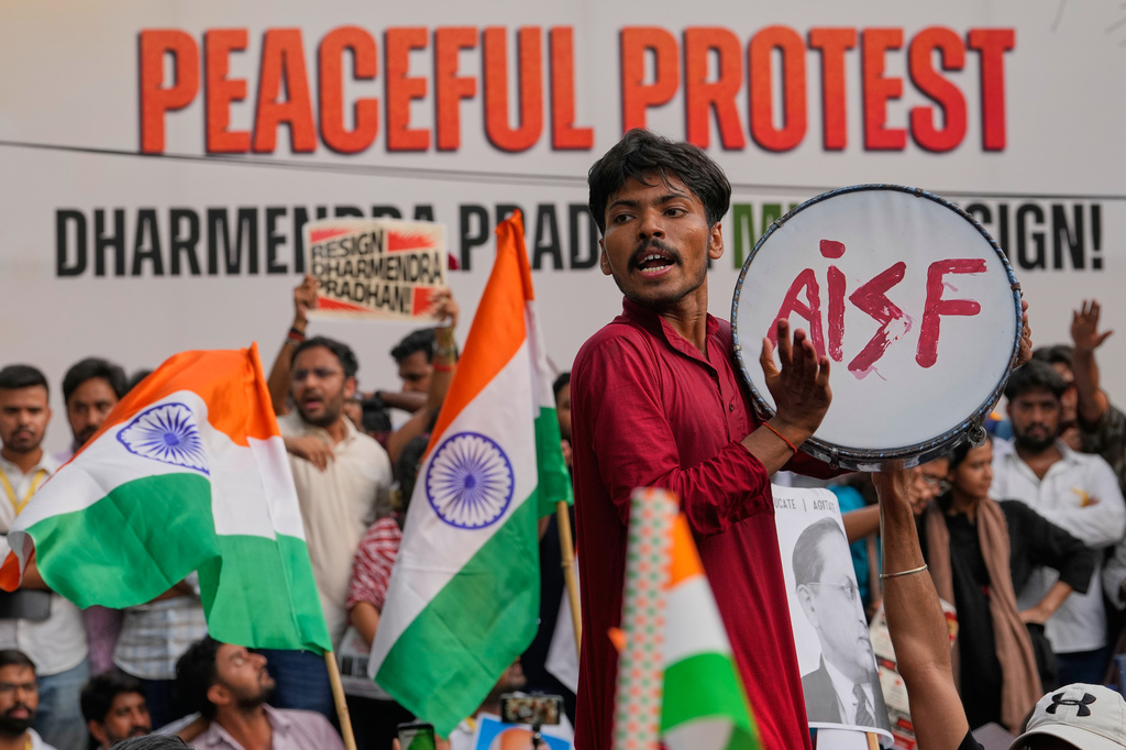 Supporters of the Cockroach Janta Party shout slogans during a protest demanding the resignation of Education Minister Dharmendra Pradhan over alleged examination irregularities and repeated paper leaks, in New Delhi, India, Saturday, June 20, 2026. (AP Photo/Manish Swarup)