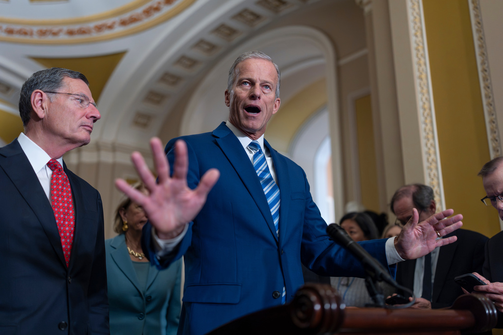 Senate Majority Leader John Thune, R-S.D., joined at left by Sen. John Barrasso, R-Wyo., the GOP whip, speaks with reporters about the struggle to end the government shutdown, at the Capitol in Washington, Wednesday, Oct. 15, 2025. (AP Photo/J. Scott Applewhite)
