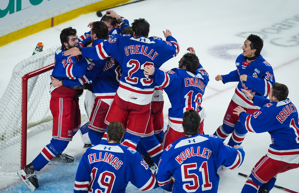 Kitchener Rangers players celebrate after defeating the Everett Silvertips to win the Memorial Cup final hockey game in Kelowna, British Columbia, on Sunday, May 31, 2026. (Darryl Dyck/The Canadian Press via AP)