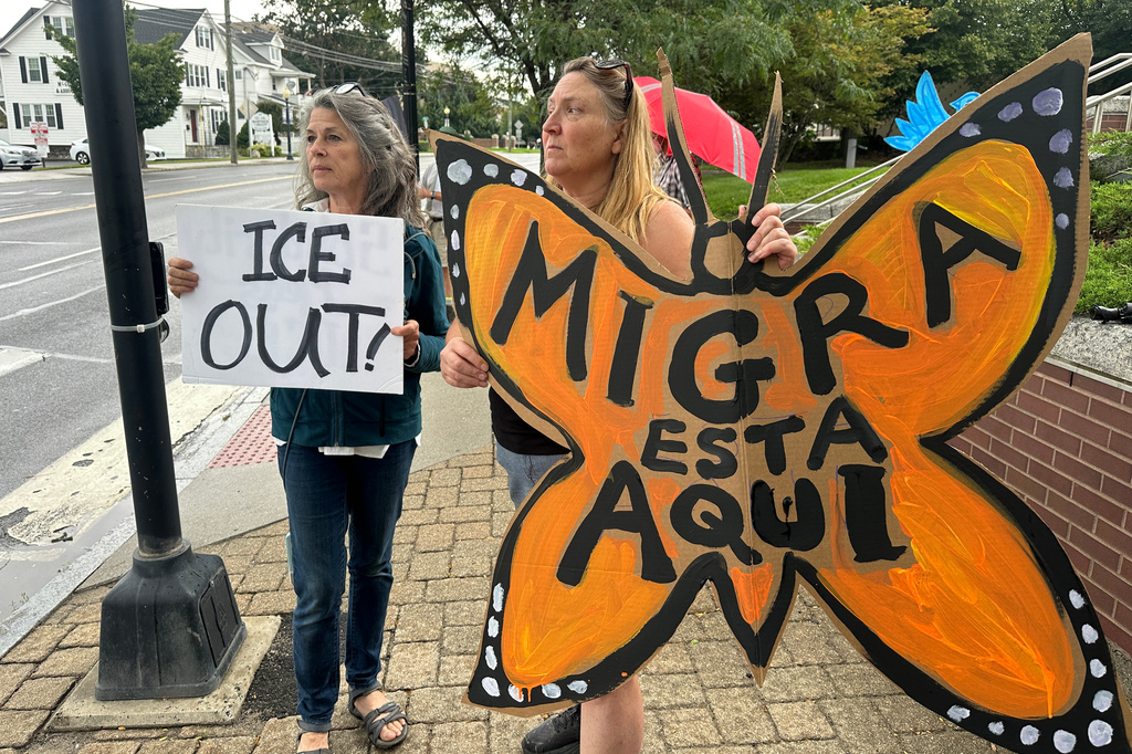 Anti-ICE activists Cheryl Harrington, left, and Julia Provey gather outside a courthouse in Danbury, Conn., Thursday, Aug. 27, 2026. (AP Photo/Ted Shaffrey)