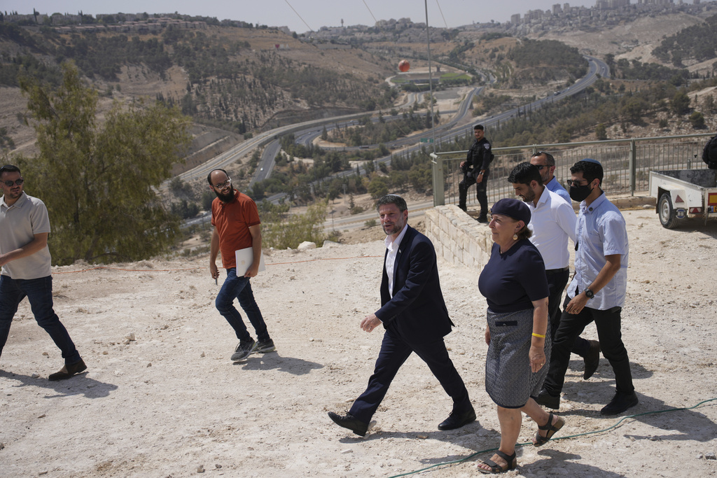 CORRECTS DAY Israeli Finance Minister Bezalel Smotrich arrives for a press conference about new settlement construction in the Israel-occupied West Bank near Maale Adumim, Thursday, Aug. 14, 2025. (AP Photo/Ohad Zwigenberg)