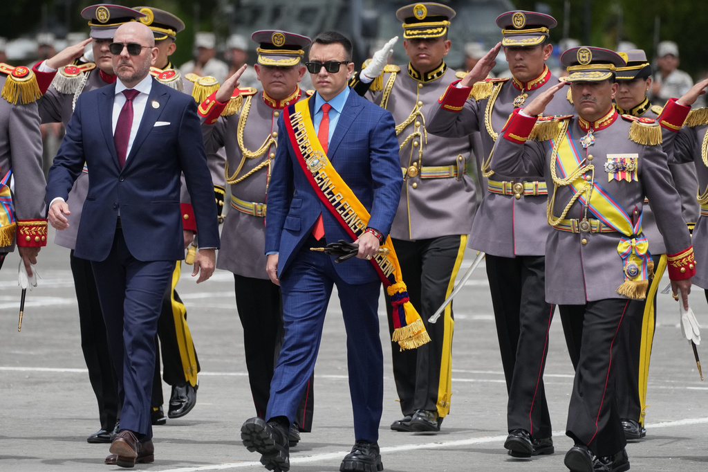FILE - President Daniel Noboa, center, Defense Minister Gian Carlo Loffredo, left, and new Army Chief Gen. Henry Delgado arrive at the change-of-command ceremony in Quito, Ecuador, Nov. 26, 2025. (AP Photo/Dolores Ochoa, File)