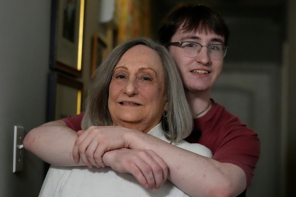 Donna West and her grandson Paul Quirk pose for a photo, Tuesday, Dec. 2, 2025, in Marietta, Ga. (AP Photo/Mike Stewart)