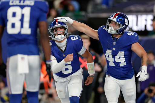 New York Giants' Jaxson Dart, center, and Cam Skattebo celebrate after a touchdown during the first half of an NFL football game against the Philadelphia Eagles Thursday, Oct. 9, 2025, in East Rutherford, N.J. (AP Photo/Adam Hunger) New York Giants' Jaxson Dart, center, and Cam Skattebo celebrate after a touchdown during the first half of an NFL football game against the Philadelphia Eagles Thursday, Oct. 9, 2025, in East Rutherford, N.J. (AP Photo/Adam Hunger)