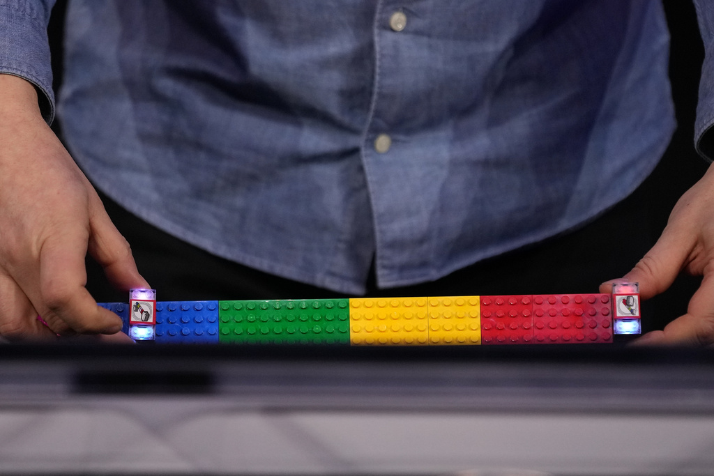 LEGO smart bricks are shown during a LEGO news conference ahead of the CES tech show Monday, Jan. 5, 2026, in Las Vegas. (AP Photo/Abbie Parr)