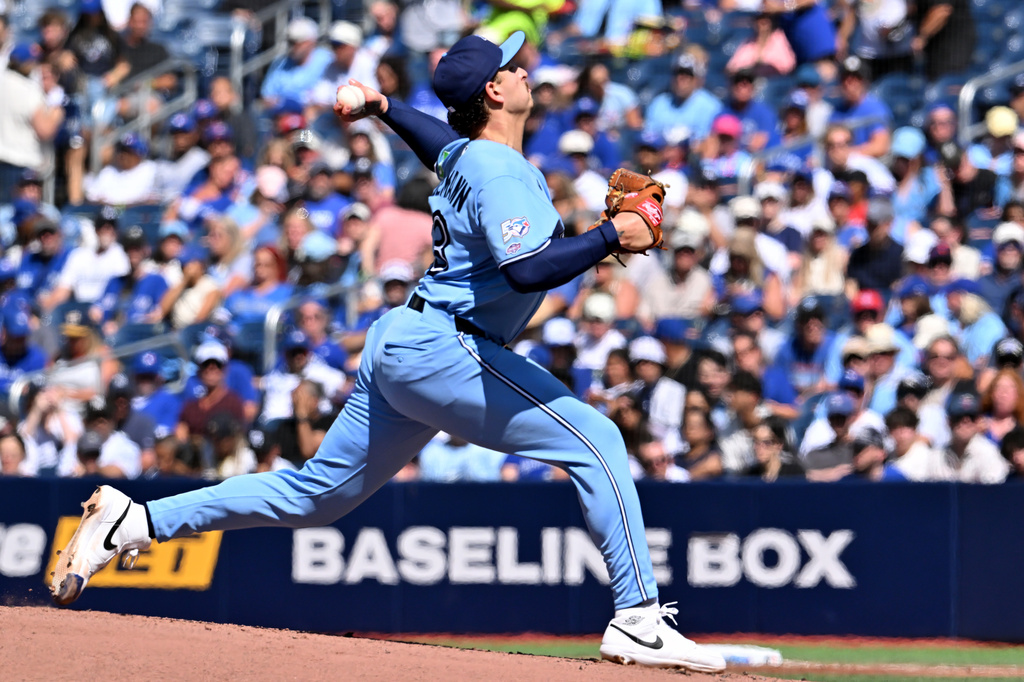 Toronto Blue Jays pitcher Ricky Tiedemann throws to a New York Yankees batter in his MLB debut during second inning of a baseball game in Toronto, Saturday, Aug. 15, 2026. (Jon Blacker/The Canadian Press via AP)