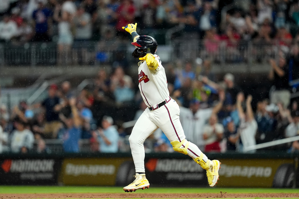Atlanta Braves' Ronald Acuña Jr. (13) celebrates after hitting a two-run homer against the Miami Marlins in the third inning of a baseball game, Thursday, Aug. 6, 2026, in Atlanta. (AP Photo/Mike Stewart)