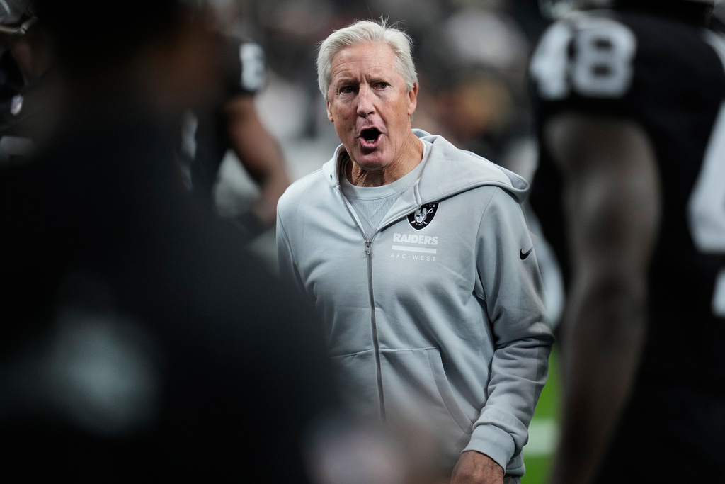 Las Vegas Raiders head coach Pete Carroll watches his team warm up before an NFL football game against the Kansas City Chiefs Sunday, Jan. 4, 2026, in Las Vegas. (AP Photo/John Locher)