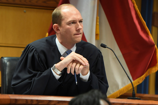 FILE - Judge Scott McAfee addresses the lawyers during a hearing on charges against former President Donald Trump in the Georgia election interference case, Thursday, March 28, 2024 in Atlanta. (Dennis Byron/Hip Hop Enquirer via AP, Pool, File) FILE - Judge Scott McAfee addresses the lawyers during a hearing on charges against former President Donald Trump in the Georgia election interference case, Thursday, March 28, 2024 in Atlanta. (Dennis Byron/Hip Hop Enquirer via AP, Pool, File)