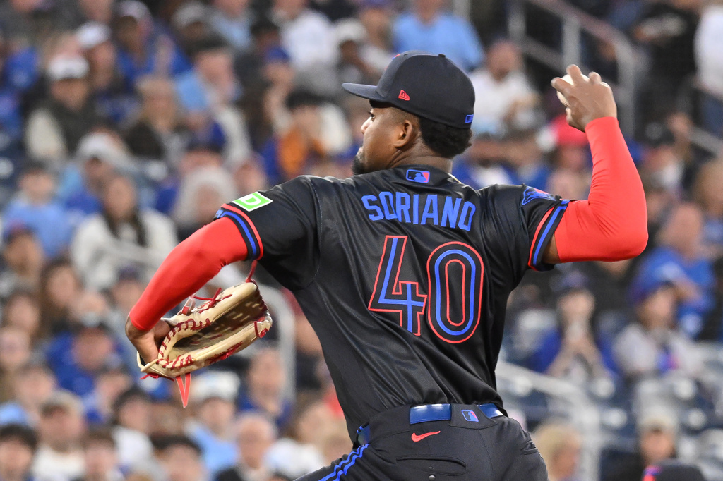 Toronto Blue Jays pitcher Jose Soriano throws to a Cincinnati Reds batter during the first inning of a baseball game in Toronto, Friday, Sept. 25, 2026. (Jon Blacker/The Canadian Press via AP)