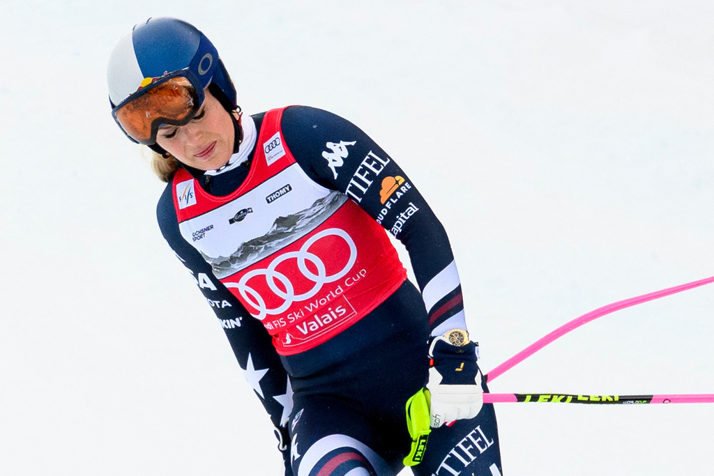 United States' Lindsey Vonn approaches the finish area after crashing, during an alpine ski, women's World Cup downhill, in Crans Montana, Switzerland, Friday, Jan. 30, 2026. (Jean-Christophe Bott/Keystone via AP)