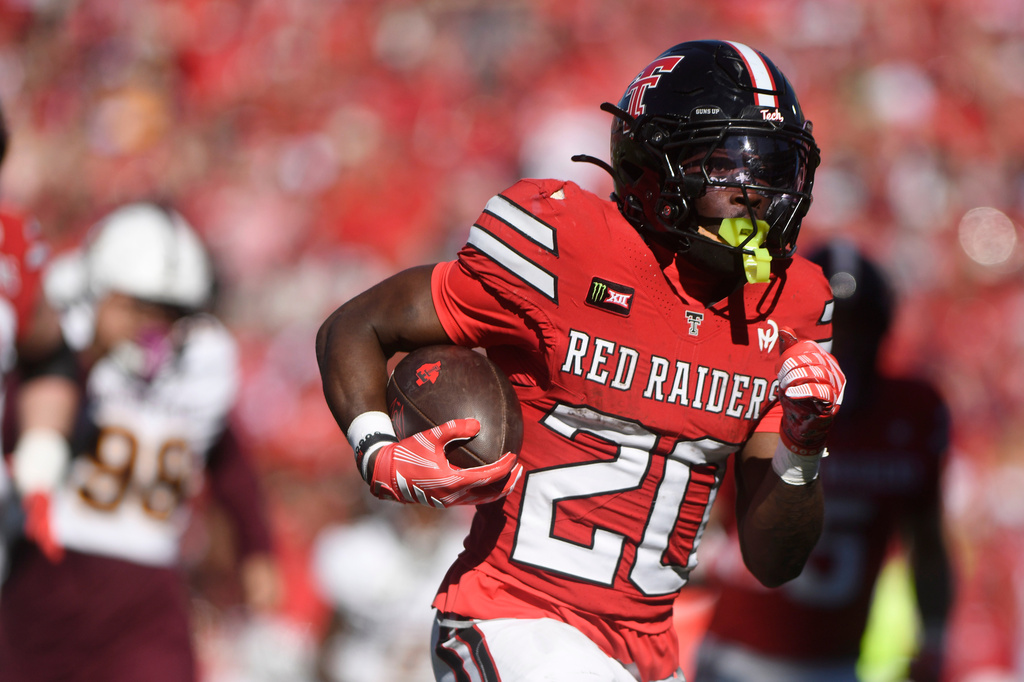 Texas Tech running back J'koby Williams (20) runs for a touchdown during the first half of an NCAA college football game against Arizona State, Saturday, Oct. 17, 2026, in Lubbock, Texas. (AP Photo/Annie Rice)