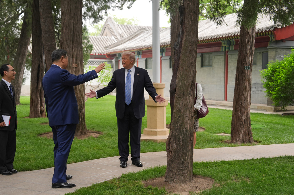 President Donald Trump talks with China's President Xi Jinping at the Zhongnanhai leadership compound, Friday, May 15, 2026, in Beijing. (AP Photo/Mark Schiefelbein, Pool)