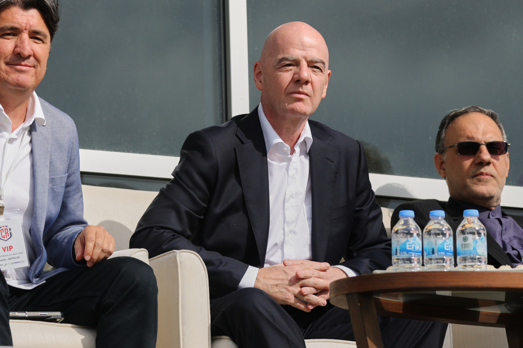 FIFA President Gianni Infantino, center, follows a friendly soccer match between Iran and Costa Rica, in Antalya, southern Turkey, Tuesday, March 31, 2026. (AP Photo/Riza Ozel)