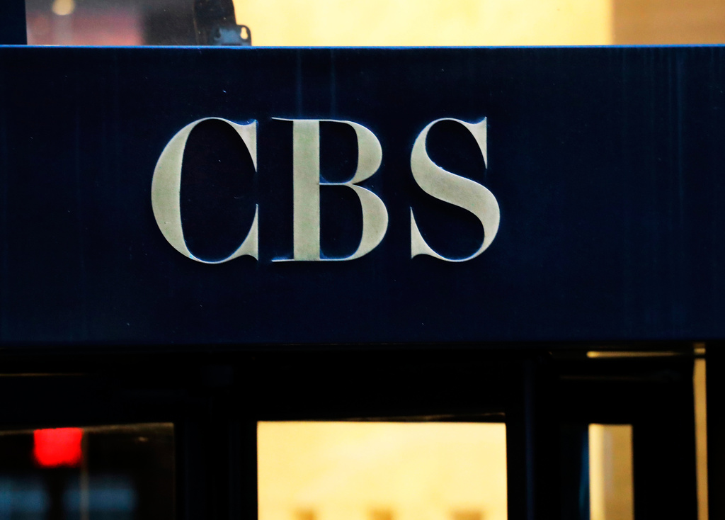 FILE - The CBS logo is displayed at the entrance to its headquarters, in New York, on Dec. 6, 2018. (AP Photo/Mark Lennihan, File)