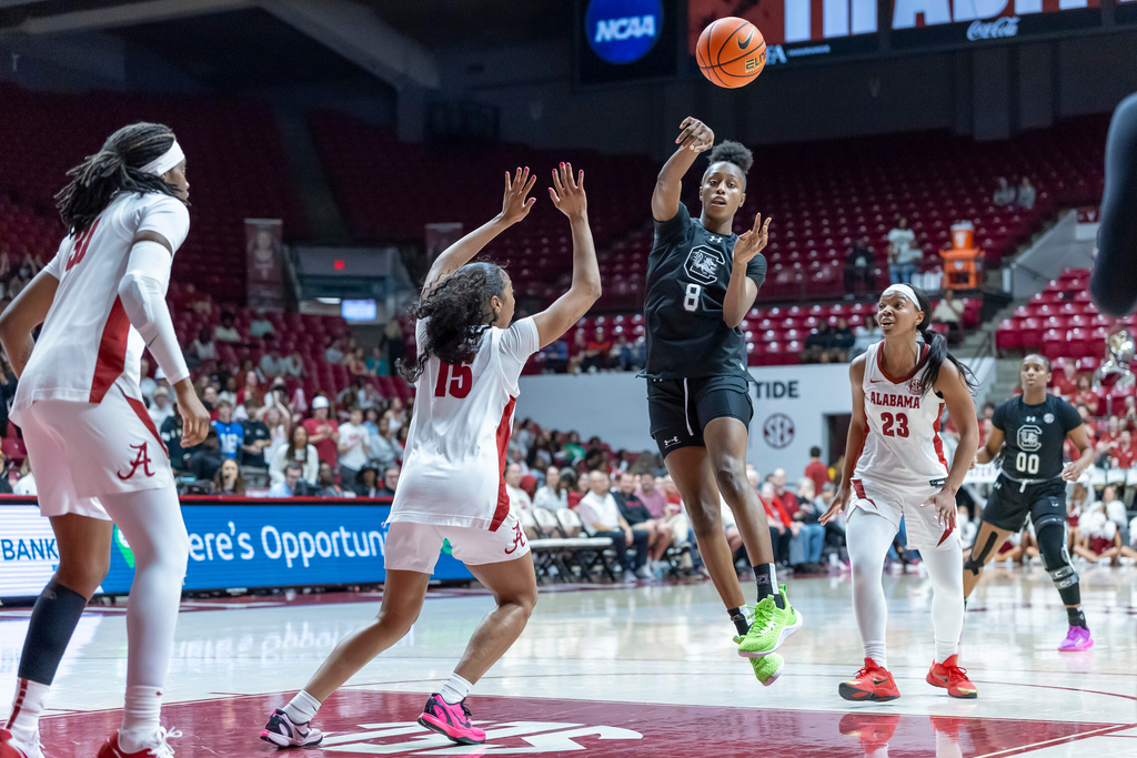 South Carolina forward Joyce Edwards (8) passes the ball past Alabama guard Ta'Mia Scott (15) during the first half of an NCAA college basketball game Thursday, Feb. 19, 2026, in Tuscaloosa, Ala. (AP Photo/Vasha Hunt)