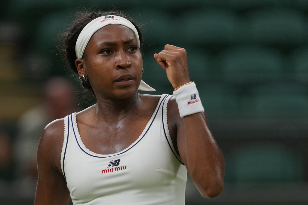 Coco Gauff of the United States celebrates a point against Belinda Bencic of Switzerland in their fourth round women's singles match at the Wimbledon Tennis Championships in London, Sunday, July 5, 2026. (AP Photo/Kin Cheung)