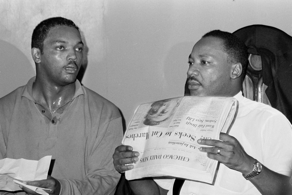 FILE - Civil rights leader Dr. Martin Luther King, Jr., right, and his aide Rev. Jesse Jackson are seen in Chicago, Aug. 19, 1966. (AP Photo/Larry Stoddard, File)