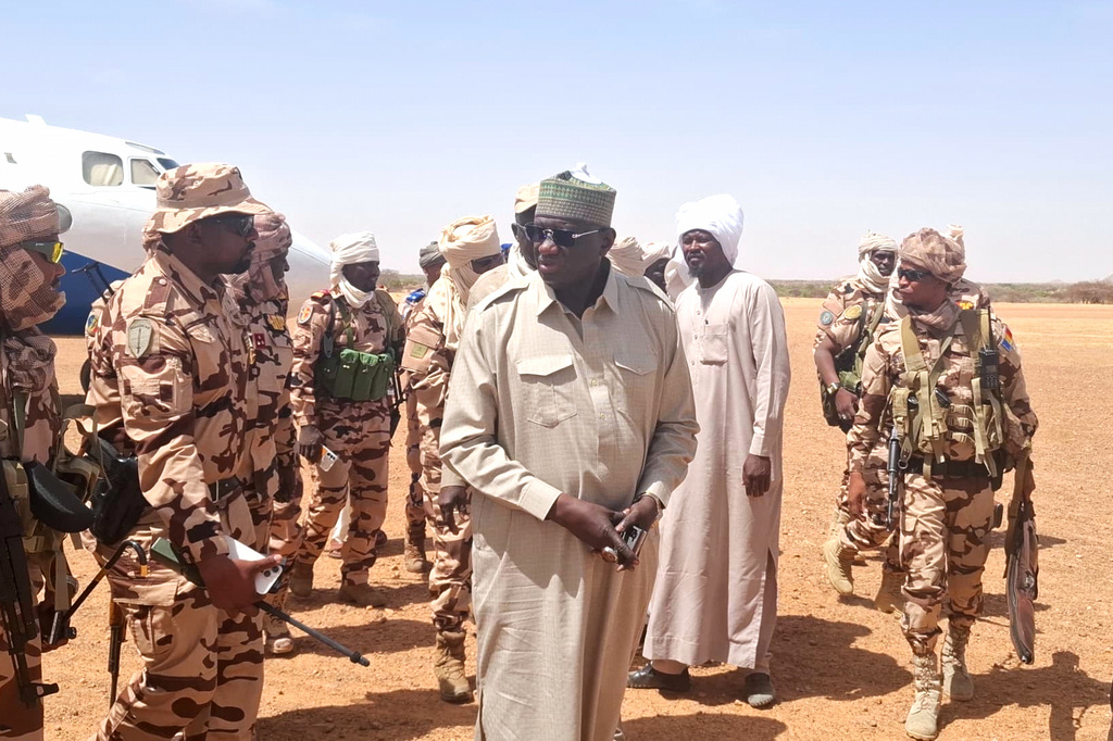 In this photo release by the Chadian Press Agency, Limane Mahamat, deputy prime minister, center, arrives at Igote village following a clash between two families over a water point, in the Wadi Fira, Chad, Sunday, April 26, 2026. (Chadian Press Agency via AP)