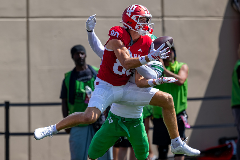 Indiana wide receiver Charlie Becker (80) makes a catch before falling into the end zone for a touchdown during the second half of an NCAA college football game against North Texas, Saturday, Sept. 5, 2026, in Bloomington, Ind. (AP Photo/Doug McSchooler)