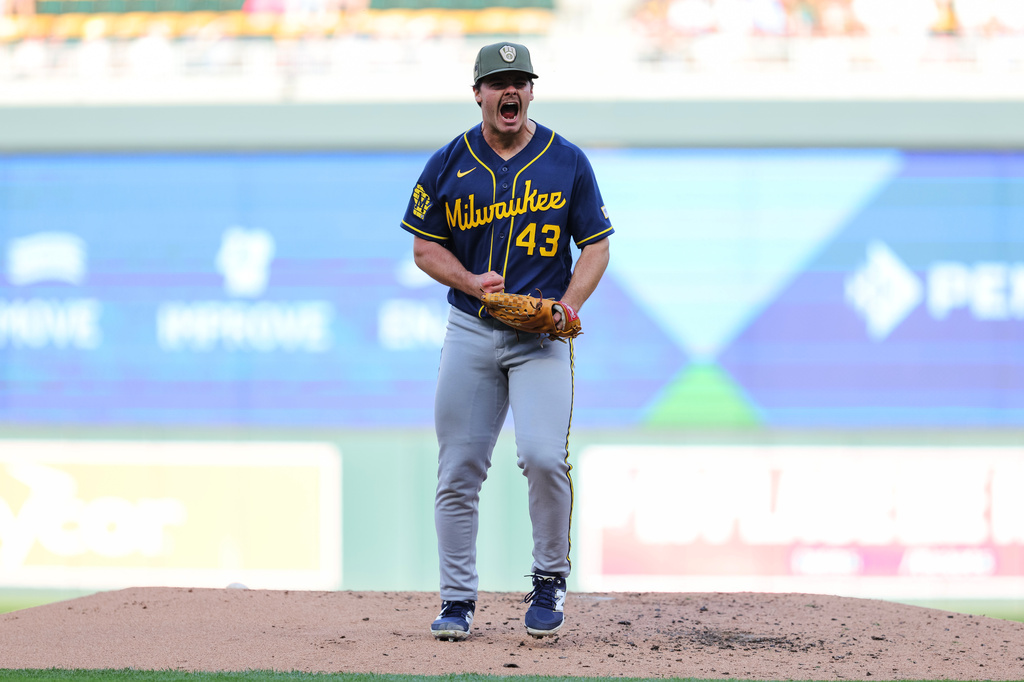 Milwaukee Brewers starting pitcher Logan Henderson celebrates after striking out Minnesota Twins' Austin Martin during the second inning of a baseball game Saturday, May 16, 2026, in Minneapolis. (AP Photo/Bailey Hillesheim)