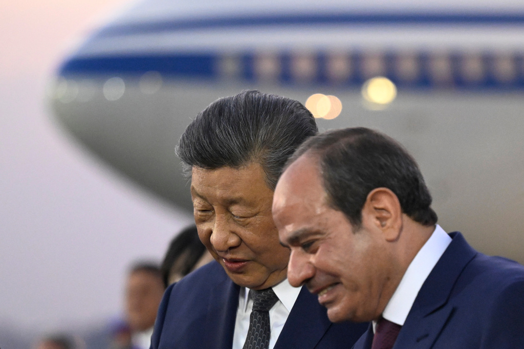 Chinese President Xi Jinping, centre, is welcomed by Egyptian President Abdel-Fattah el-Sissi at Cairo International Airport in Cairo, Egypt, Tuesday, Sept. 1, 2026. (Khaled Desouki/Pool Photo via AP)