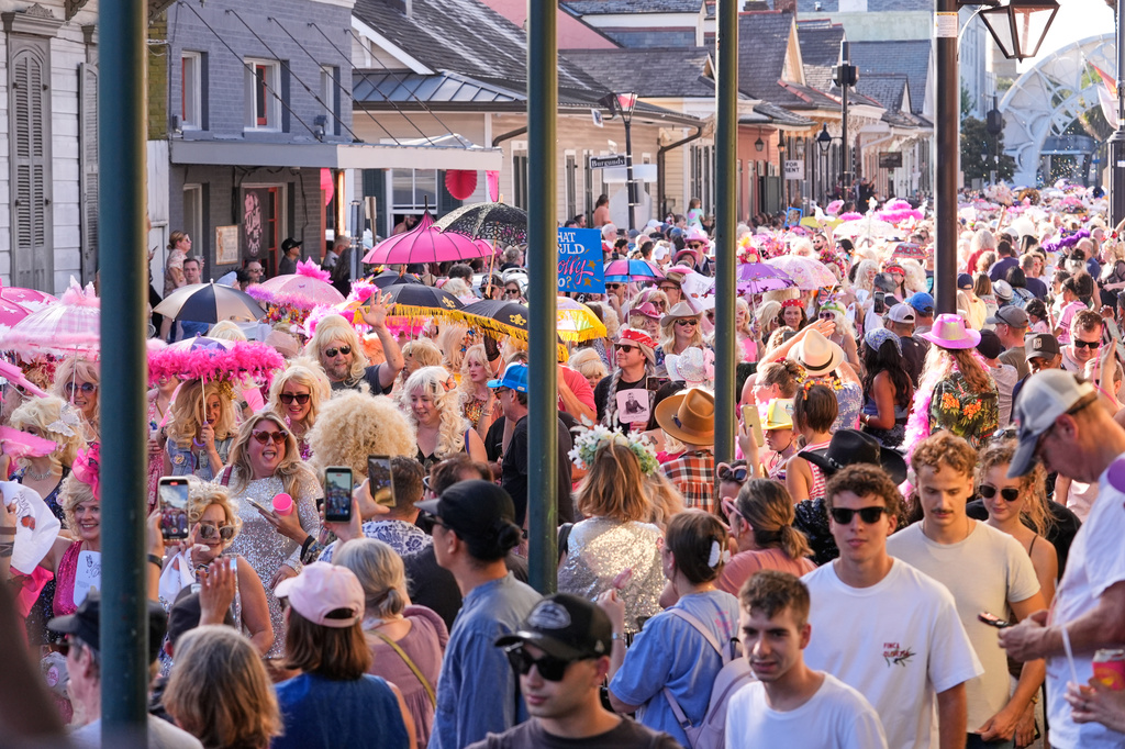 Members of the Krewe of Dolly lead a second line parade in commemoration of the life of Dolly Parton through the French Quarter Friday, Sept. 25, 2026, in New Orleans. (AP Photo/Gerald Herbert)