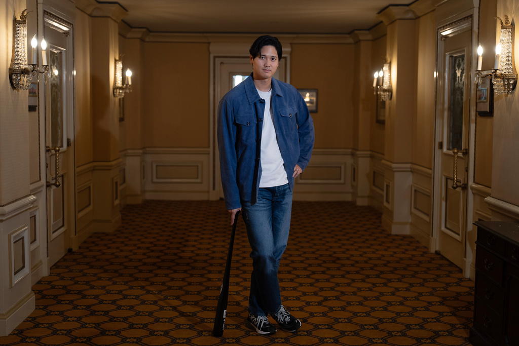 Los Angeles Dodgers' Shohei Ohtani poses for photos after an interview with The Associated Press in Pasadena, Calif., Wednesday, Nov. 26, 2025. (AP Photo/Jae C. Hong)