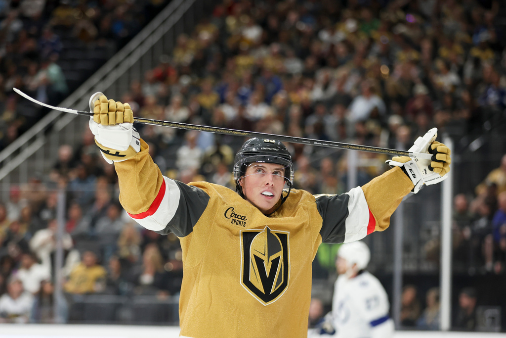 Vegas Golden Knights right wing Mitch Marner (93) reacts after missing a shot against the Tampa Bay Lightning during the second period of an NHL hockey game Thursday, Nov. 6, 2025, in Las Vegas. (AP Photo/Ian Maule)
