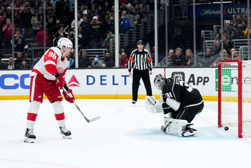 FILE - Detroit Red Wings right wing Patrick Kane (88) scores against Los Angeles Kings goaltender David Rittich during the shootout in an NHL hockey game Jan. 4, 2024, in Los Angeles. The Red Wings won 4-3. (AP Photo/Jae C. Hong, File)