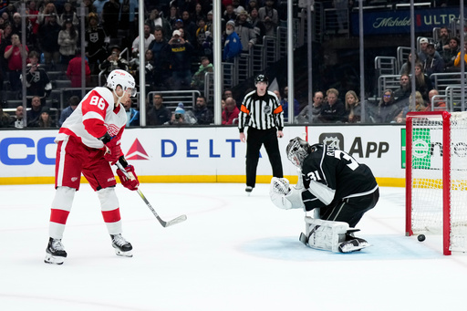 FILE - Detroit Red Wings right wing Patrick Kane (88) scores against Los Angeles Kings goaltender David Rittich during the shootout in an NHL hockey game Jan. 4, 2024, in Los Angeles. The Red Wings won 4-3. (AP Photo/Jae C. Hong, File) FILE - Detroit Red Wings right wing Patrick Kane (88) scores against Los Angeles Kings goaltender David Rittich during the shootout in an NHL hockey game Jan. 4, 2024, in Los Angeles. The Red Wings won 4-3. (AP Photo/Jae C. Hong, File)