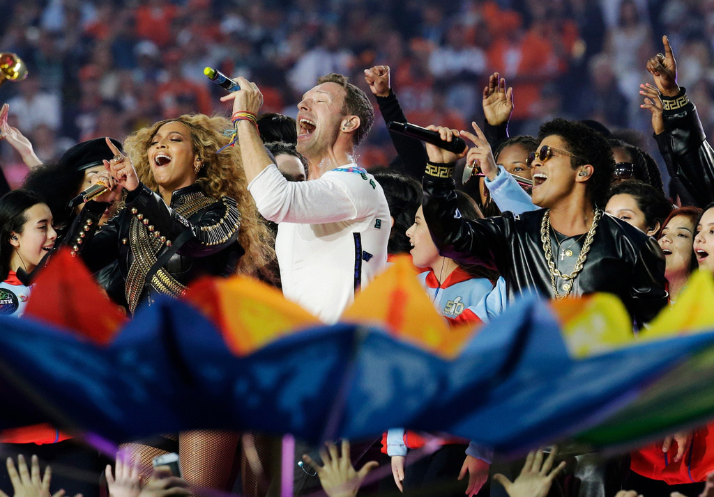FILE - Beyoncé, from left, Coldplay singer Chris Martin and Bruno Mars perform during halftime of the NFL Super Bowl 50 football game in Santa Clara, Calif., on Feb. 7, 2016. (AP Photo/Julio Cortez, File)