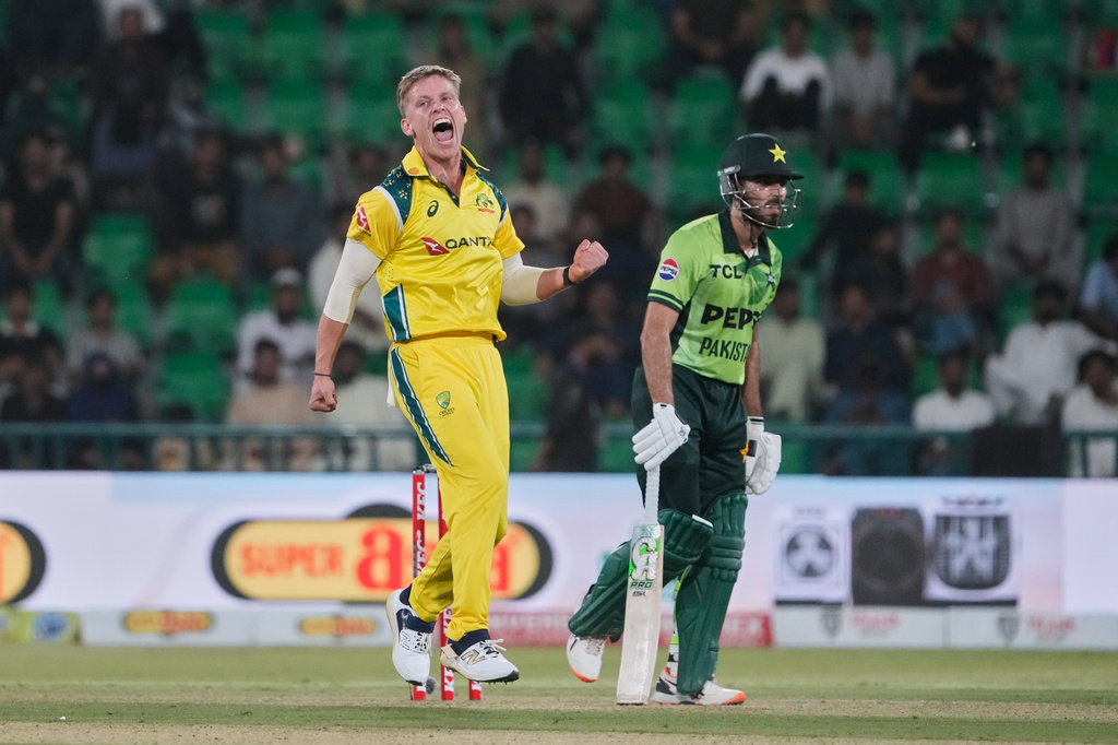Australia's Nathan Ellis, left, celebrates after the dismissal of Pakistan's Arafat Minhas, right, during the second one-day international cricket match between Pakistan and Australia, in Lahore, Pakistan, Tuesday, June 2, 2026. (AP Photo/K.M. Chaudary)