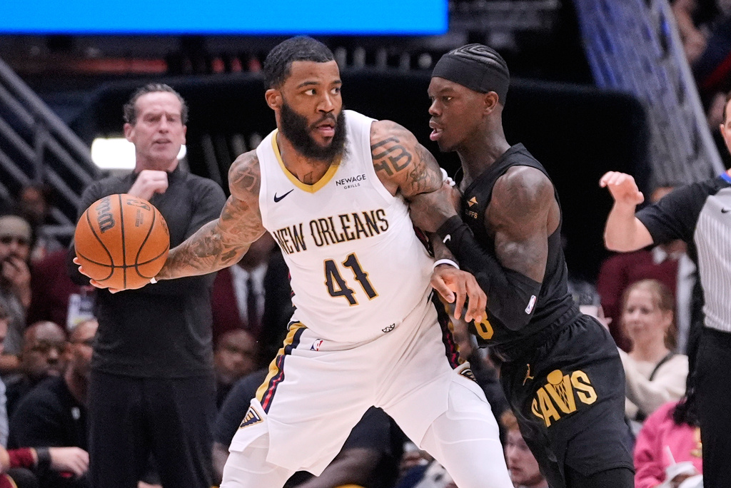 New Orleans Pelicans guard Saddiq Bey (41) works the ball against Cleveland Cavaliers guard Dennis Schroder (8) in the first half of an NBA basketball game, Saturday, March 21, 2026, in New Orleans. (AP Photo/Gerald Herbert)