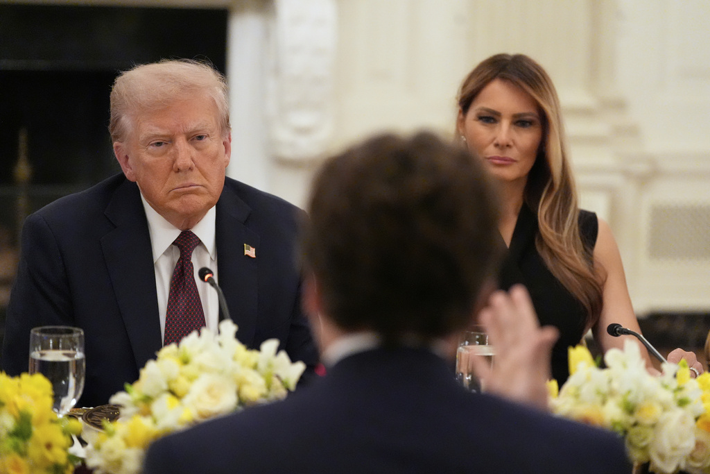 President Donald Trump and first lady Melania Trump listen during a dinner in the State Dinning Room of the White House, Thursday, Sept. 4, 2025, in Washington. (AP Photo/Alex Brandon)