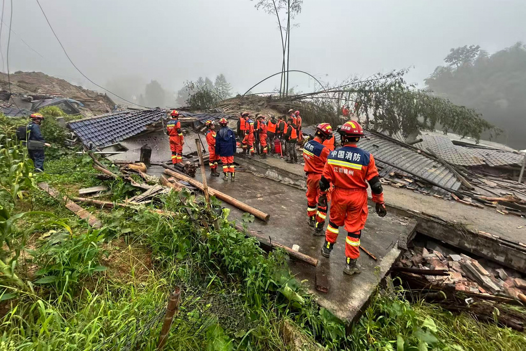 In this photo released by Xinhua News Agency, rescuers conduct a rescue operation at the site of a mudslide following days of heavy rain from tropical cyclone Saudel in Suichuan County of Ji'an City, east China's Jiangxi Province on Saturday, Sept. 5, 2026. (China Anneng Group Second Engineering Bureau Co., Ltd./Xinhua via AP)