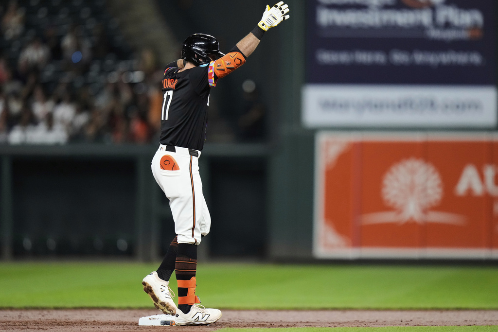 Baltimore Orioles' Colton Cowser celebrates on second base after hitting a double during the second inning of a baseball game against the New York Yankees, Friday, Sept. 19, 2025, in Baltimore. (AP Photo/Stephanie Scarbrough)