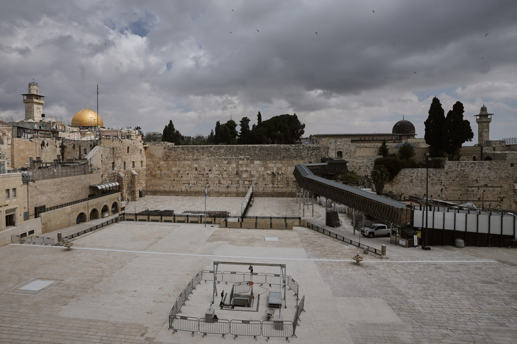 The Western Wall plaza in Jerusalem's Old City stands empty as the area remains closed to visitors amid the war with Iran. Wednesday, March 25, 2026. (AP Photo/Mahmoud Illean)