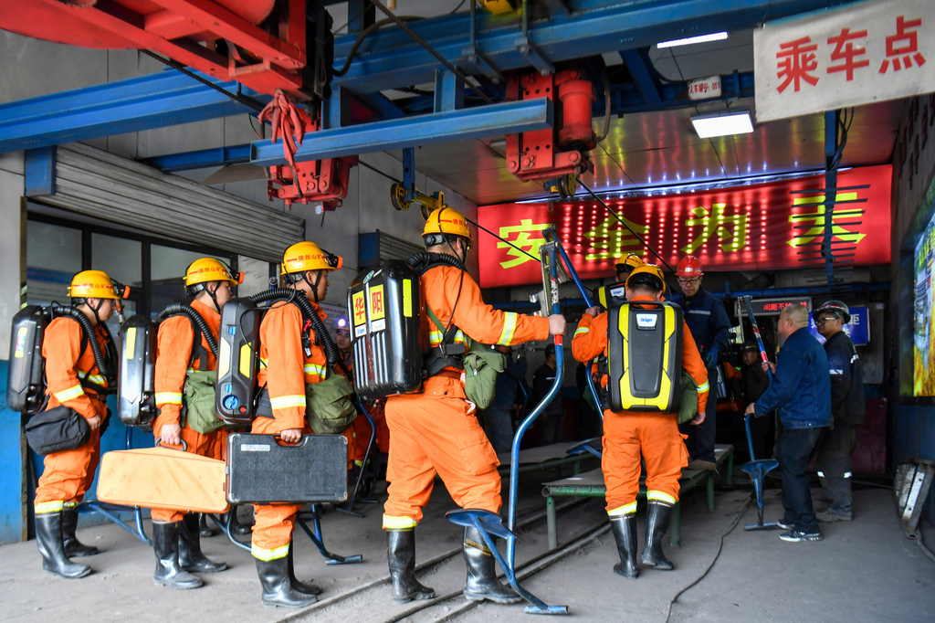 In this photo released by Xinhua News Agency, rescue workers prepare to descend into a coal mine in the aftermath of an explosion at Changzhi city's Liushenyu coal mine in Qinyuan county, northern China's Shanxi Province on Saturday, May 23, 2026. (Cao Yang/Xinhua via AP)