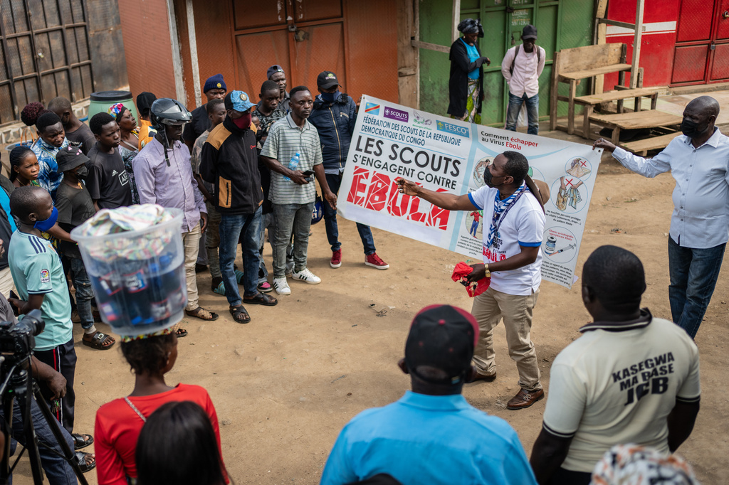 Francois Kasereka, a member of the Congo Scouts movement, speaks to people during a public sensitisation campaign amid the Ebola outbreak in Bunia, Congo, Saturday, May 23, 2026. (AP Photo/Moses Sawasawa)
