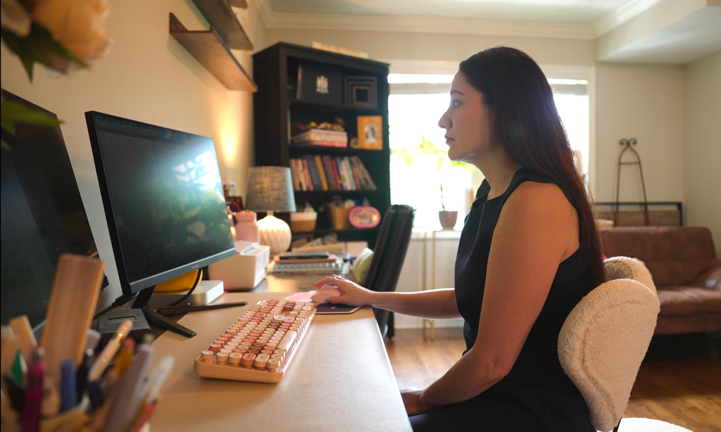 Elsa Sanchez checks on her DACA renewal application on Wednesday, April 29, 2026, in Atlanta. (AP Photo/Emilie Megnien)