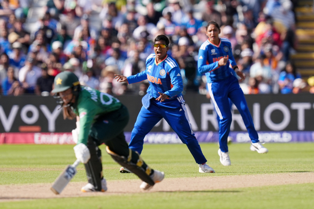India's Deepti Sharma attempts to run out Pakistan's Natalia Parvaiz during the ICC Women's T20 World Cup, Group 1 cricket match between India and Pakistan in Birmingham, England, Sunday, June 14, 2026. (Jacob King/PA via AP)
