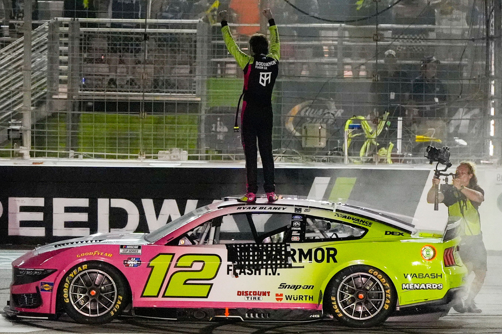 Ryan Blaney celebrates after winning a NASCAR Cup Series auto race, Sunday, July 12, 2026, in Hampton, Ga. (AP Photo/Mike Stewart)