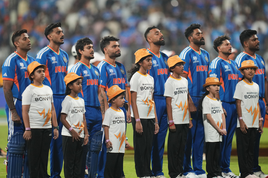 India's players stand up for the national anthems before the start of the T20 World Cup cricket match between India and the United States in Mumbai, India, Saturday, Feb. 7, 2026. (AP Photo/Rafiq Maqbool)