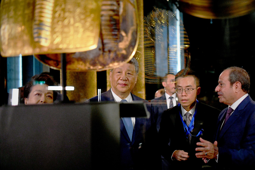 In this photo provided by the Egyptian presidential press office, Chinese President Xi Jinping, center, and Egyptian President Abdel-Fattah el-Sissi, right, tour a gallery displaying the gold funerary mask of Tutankhamun at the Grand Egyptian Museum in Giza, Egypt, Wednesday, Sept. 2, 2026. (Egyptian Presidential Press Office via AP)