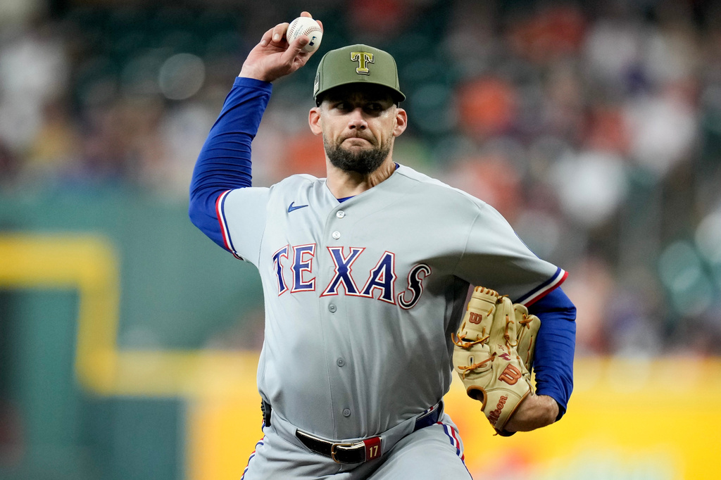 Texas Rangers starting pitcher Nathan Eovaldi throws against the Houston Astros during the first inning of a baseball game, Sunday, May 17, 2026, in Houston. (AP Photo/Eric Christian Smith)