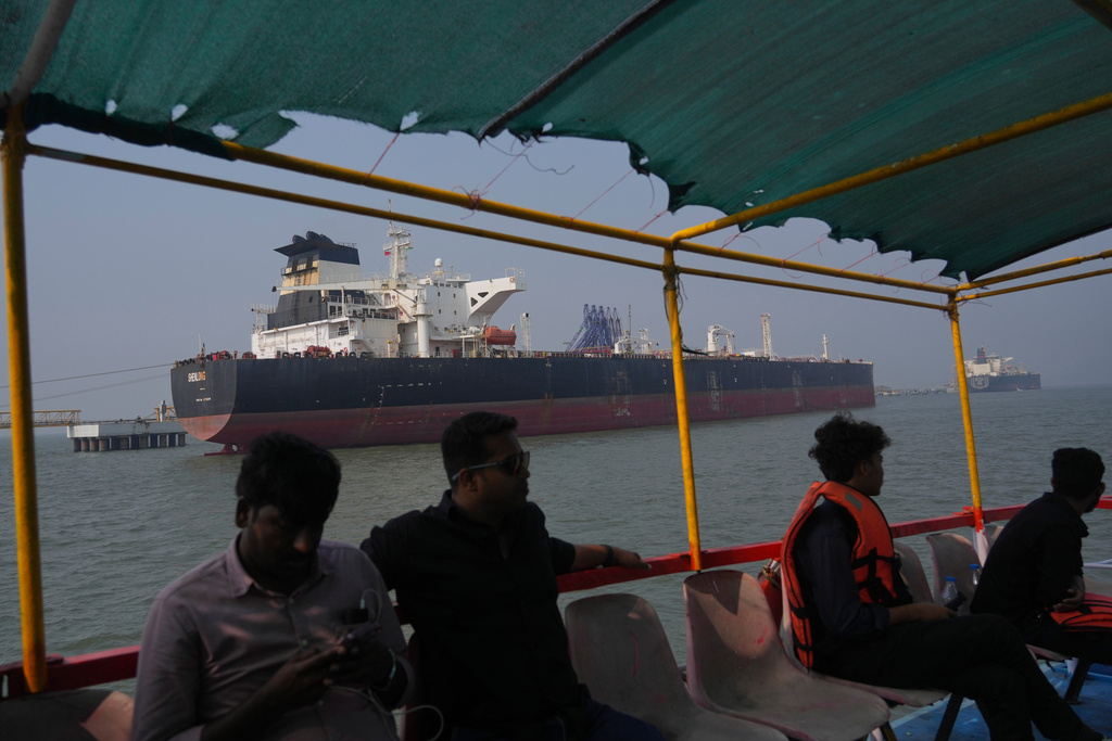 Liberia-flagged tanker Shenlong Suezmax, carrying crude oil from Saudi Arabia, that arrived clearing the Strait of Hormuz, is seen at the Mumbai Port in Mumbai, India, Thursday, March 12, 2026. (AP Photo/Rafiq Maqbool)