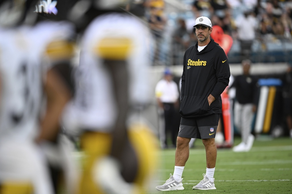 Pittsburgh Steelers' Aaron Rodgers watches before an NFL preseason football game against the Jacksonville Jaguars, Saturday, Aug. 9, 2025, in Jacksonville, Fla. (AP Photo/Phelan M. Ebenhack)