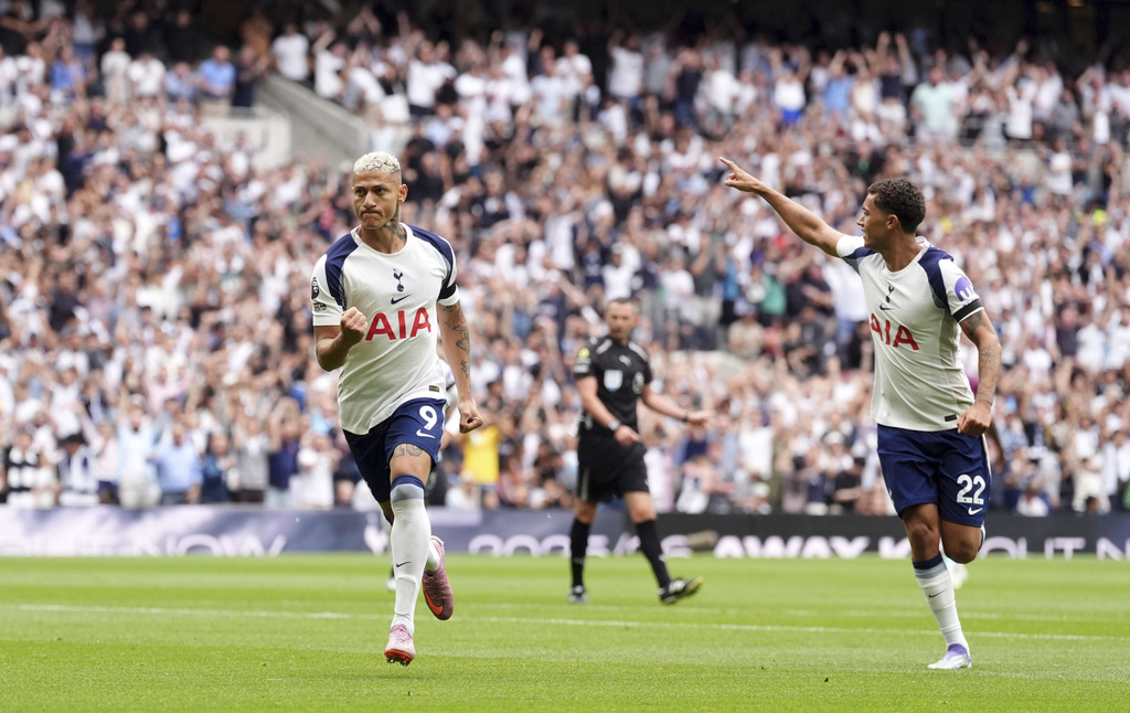 Tottenham Hotspur's Richarlison, left, celebrates scoring the opening goal during the the English Premier League soccer match between Tottenham Hotspur and Burnley at the Tottenham Hotspur Stadium in London, Saturday, Aug. 16, 2025. (Adam Davy/PA via AP)
